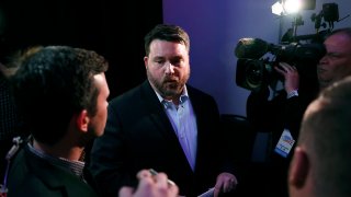 Iowa Democratic Party chairman Troy Price speaks to reporters about the delay in Iowa caucus results, Feb. 4, 2020, in Des Moines, Iowa.