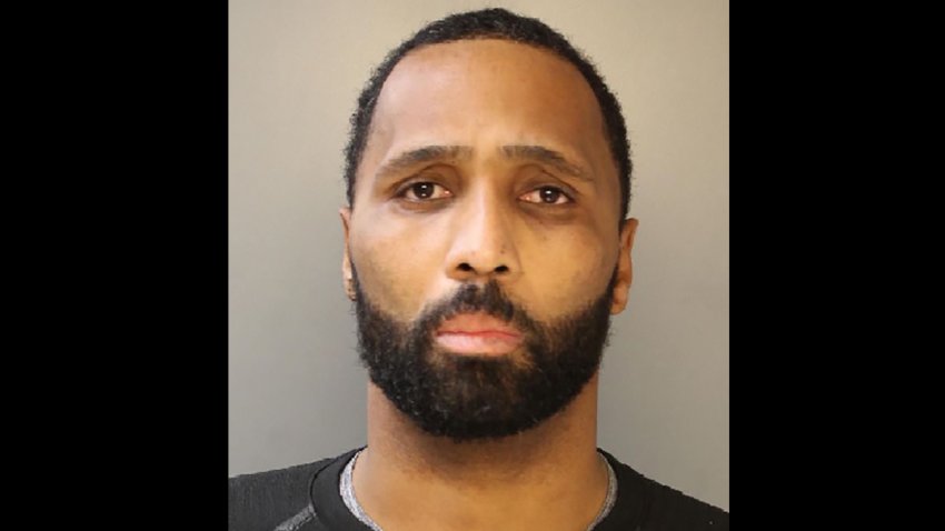 Philadelphia Police Sergeant Jason Reid looks at the camera in a mug shot.