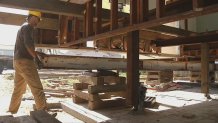 Crews placed steel beams underneath the home. April 20, 2016
