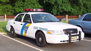 A New Jersey State Police cruiser is shown.