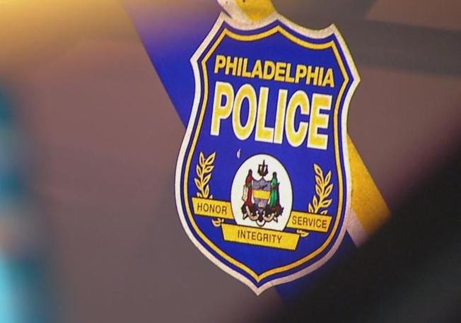 A Philadelphia police department logo shows a badge with "Philadelphia Police" written on it.
