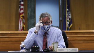 Sen. Richard Burr, R-N.C., wears a face mask and gloves during a Senate Health, Education, Labor, and Pensions Committee hearing, May 12, 2020, in Washington.