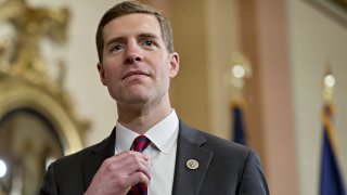 Representative Conor Lamb, a Democrat from Pennsylvania, adjusts his tie in the speakers ceremonial room