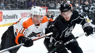 Tyler Pitlick #18 of the Philadelphia Flyers and Matt Roy #3 of the Los Angeles Kings battle for position during the second period at STAPLES Center on December 31, 2019 in Los Angeles, California.
