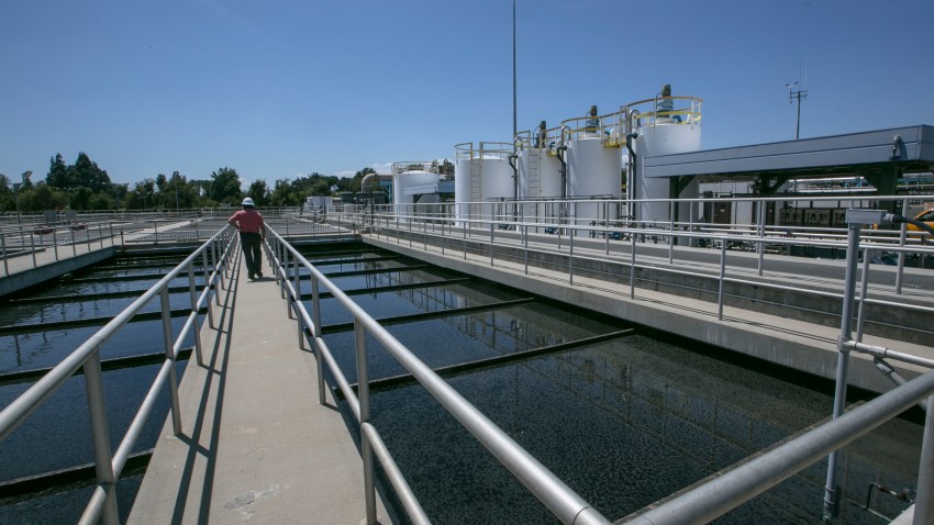 In this May 20, 2015, file photo, Michael Ruiz, shift superintendent for Wastewater Treatment II, at the Donald C. Tillman Water Reclamation Plant tours the Secondary Treatment Clarifiers tanks at the Los Angeles Sanitation plant where millions of gallons of wastewater are purified each day in Van Nuys, Calif.