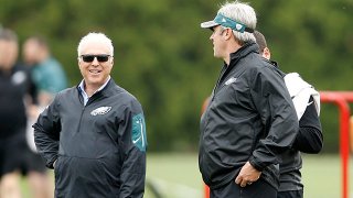 Philadelphia Eagles head coach Doug Pederson, right, speaks with team owner Jeffrey Lurie