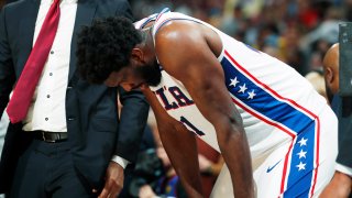 Philadelphia 76ers center Joel Embiid reacts after fouling out against the Denver Nuggets late in the second half of an NBA basketball game Friday, Nov. 8, 2019, in Denver.