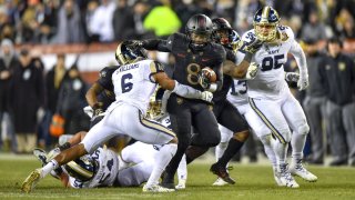 Army Black Knights quarterback Kelvin Hopkins Jr. (8) pushes his way past Navy Midshipmen safety Sean Williams and heads up the middle during the football game between the Army Black Knights and the Navy Midshipmen on December 08, 2018 at Lincoln Financial Field in Philadelphia PA