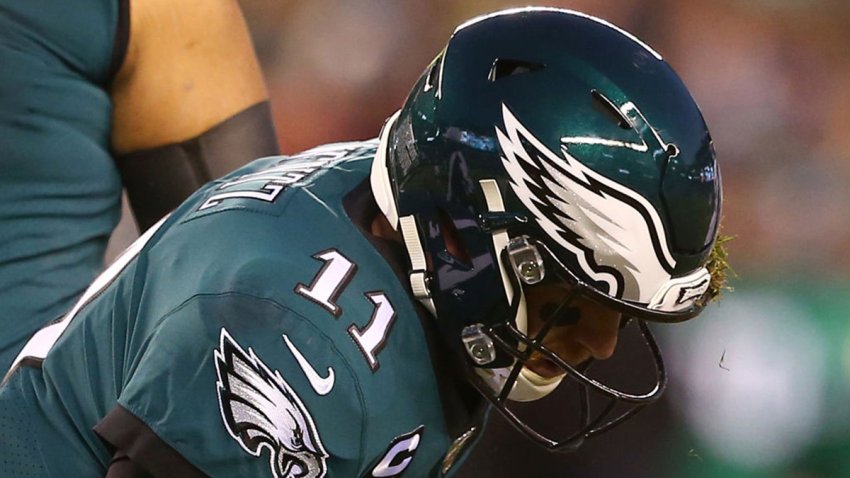 PHILADELPHIA, PENNSYLVANIA – JANUARY 05: Quarterback Carson Wentz #11 of the Philadelphia Eagles gets up after a hit by Jadeveon Clowney #90 of the Seattle Seahawks during the NFC Wild Card Playoff game at Lincoln Financial Field on January 05, 2020 in Philadelphia, Pennsylvania. (Photo by Mitchell Leff/Getty Images)