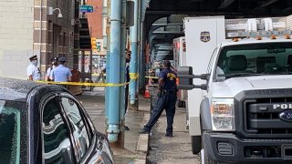 Philadelphia police investigate a body found in a suitcase