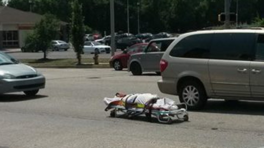 dead body falls out of coroner van crop2