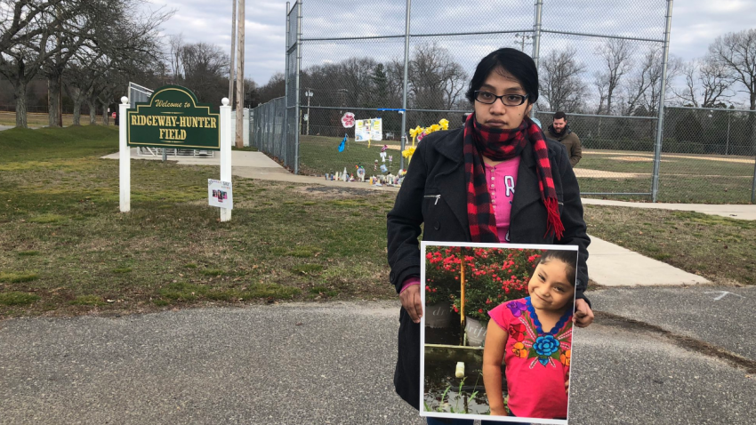 Noema Alavez Pérez holds portrait of her daughter, Dulce María, who remains missing.