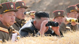 North Korean leader Kim Jong Un supervises an artillery throwing competition