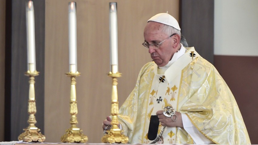 Pope Francis officiates an open-air mass in Ecuador
