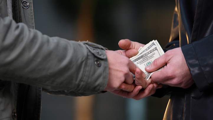 generic bribe bribery generic money changing hands