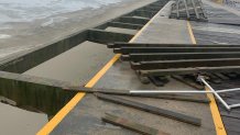 A look at damage done to the Wildwood Boardwalk during Monday's windy weather.