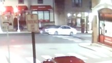 A white sedan crosses an intersection before a fatal hit-and-run crash in Jenkintown, Pennsylvania.