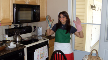 Leah Lupo cooks in an apron with the colors of Italy's flag.