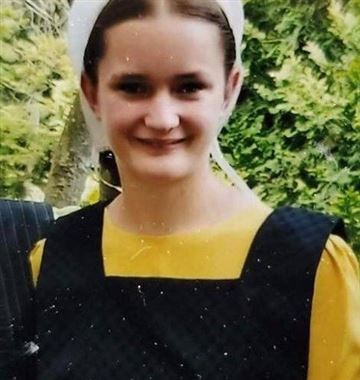 smiling girl in apron and dress