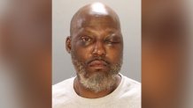 Marvin Scott looks at the camera in a police mug shot. He is suspected of stabbing his ex-girlfriend to death in Southwest Philadelphia.