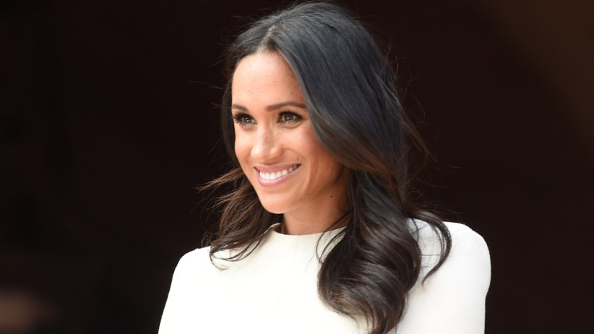 In this June 14, 2018, file photo, Meghan, Duchess of Sussex, and Queen Elizabeth II (not pictured) visit Chester Town Hall in Chester, England.