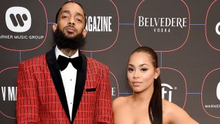 In this file photo, Nipsey Hussle and Lauren London arrive at the Warner Music Group Pre-Grammy Celebration at Nomad Hotel Los Angeles on February 7, 2019 in Los Angeles, California.