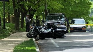 A Pennsylvania State Police motorcycle on its side after a hit-and-run crash in Philadelphia.
