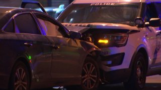 A sedan and a Philadelphia police SUV crash in the city's Kensington neighborhood.