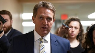 In this file photo, U.S. Sen. Jeff Flake (R-AZ) speaks to members of the media in the basement of the U.S. Capitol prior to a Senate Republican Policy Luncheon January 17, 2018 in Washington, D.C.