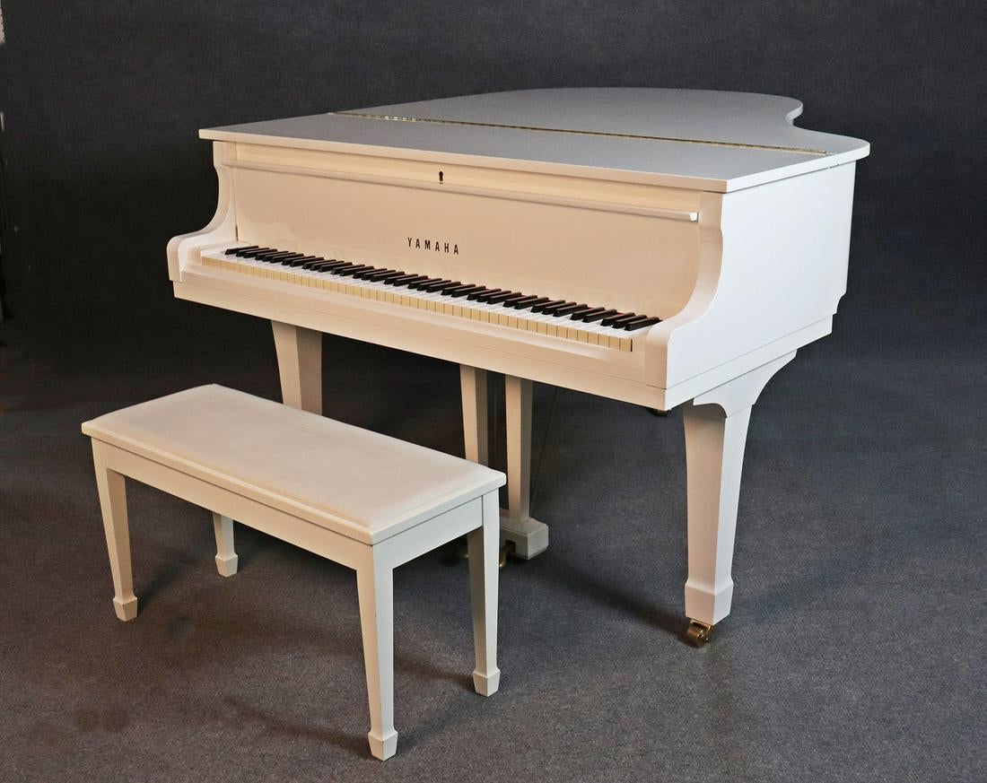 Yamaha baby grand white lacquered piano.