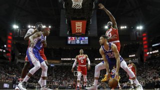 Ben Simmons #25 of the Philadelphia 76ers drives to the basket defended by James Harden #13 of the Houston Rockets