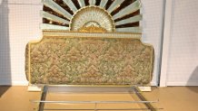 Wood and upholstered base headboard with upper section with Lalique style sunrise motif. Etched glass. Brass bed frame.