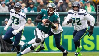 Philadelphia Eagles quarterback Carson Wentz (11) runs with the ball against the Seattle Seahawks at Lincoln Financial Field