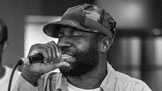 This undated image provided by @mpozitolbertphotography shows Malik B performing in studio. The rapper and founding member of The Roots, has died. He was 47.