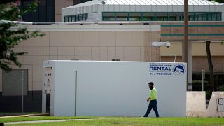 A refrigerated trailer sits outside of HCA Houston Healthcare Northwest on July 17, 2020.