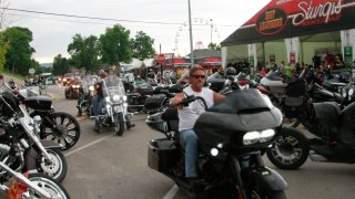 Bikers ride through downtown Sturgis, S.D., on Friday, Aug. 7, 2020