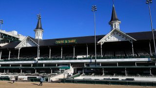 A view of the twin spires and empty grandstand at Churchill Downs, May 2, 2020, in Louisville, Ky.