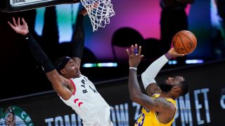 Los Angeles Lakers' LeBron James (23) shoots against Toronto Raptors' Rondae Hollis-Jefferson (4) during the second half of an NBA basketball game Saturday, Aug. 1, 2020, in Lake Buena Vista, Fla.