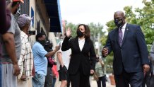 Democratic vice presidential candidate Sen. Kamala Harris, D-Calif., meets Congressman Dwight Evans during a campaign stop, Thursday, Sept. 17, 2020, in Philadelphia.