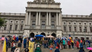 People rally for gun rights on the rainy steps of the Pennsylvania Capitol on Tuesday, Sept. 29, 2020, in Harrisburg, Pennsylvania.