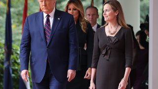 President Donald Trump (L) arrives to introduce 7th U.S. Circuit Court Judge Amy Coney Barrett as his nominee to the Supreme Court in the Rose Garden at the White House Sept. 26, 2020, in Washington. With 38 days until the election, Trump tapped Barrett to be his third Supreme Court nominee in just four years and to replace the late Associate Justice Ruth Bader Ginsburg, who will be buried at Arlington National Cemetery on Tuesday.