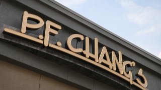 A sign hangs above a P.F. Chang's restaurant
