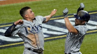 Tampa Bay Rays' Brandon Lowe, right, celebrates his a two-run home run with Willy Adames against the Los Angeles Dodgers during the fifth inning in Game 2 of the baseball World Series Wednesday, Oct. 21, 2020, in Arlington, Texas.