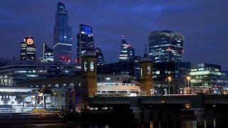 A pumpkin is illuminated on Tower 42 to celebrate Halloween, Oct. 31, 2020, in London, England.