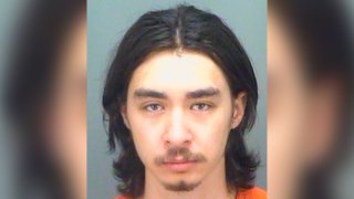 This photo provided by the Pinellas County, Fla., Jail, shows Thomas Parkinson-Freeman, 23, who was was arrested early Monday morning, Oct. 19, 2020, and charged with manslaughter, after allegedly fatally shooting his twin brother while they were joking around in an SUV, authorities said.