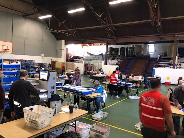 Inside the mail-in ballot counting center in Chester County, workers opened envelopes and got the ballots ready to be counted beginning on Wednesday.