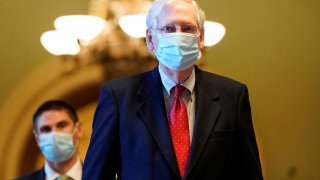 Senate Majority Leader Mitch McConnell (R-KY) walks from the Senate Chamber to his office on Capitol Hill in Washington, December 11, 2020.