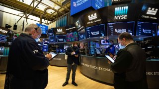 Traders work on the floor of the New York Stock Exchange.