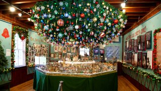 A Christmas display featuring ornaments and a model village