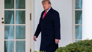 U.S. President Donald Trump walks to the Oval Office while arriving back at the White House on December 31, 2020 in Washington, DC.